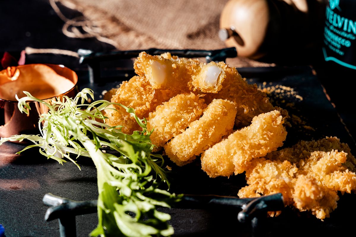 Crispy breaded fish fingers served with salad