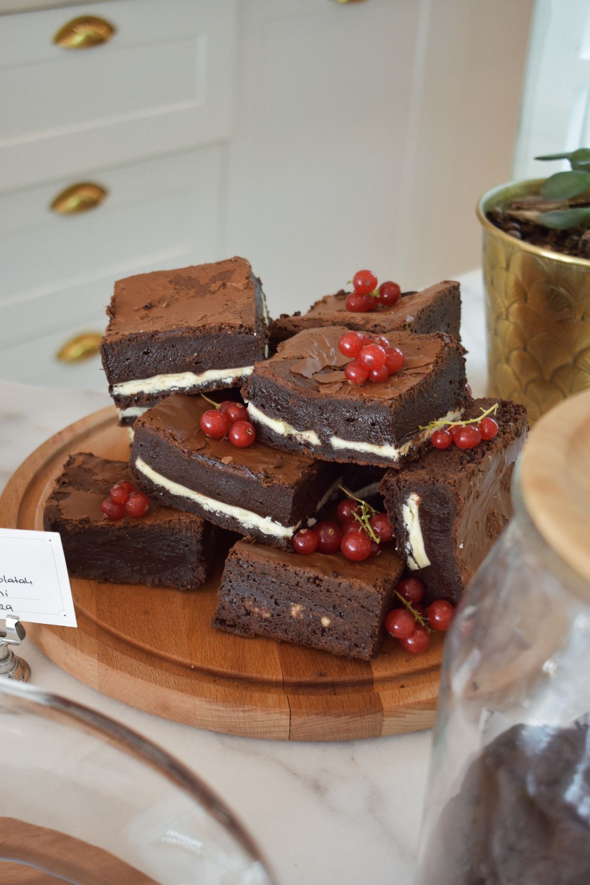 Chocolate brownies cut into squares on a wooden board