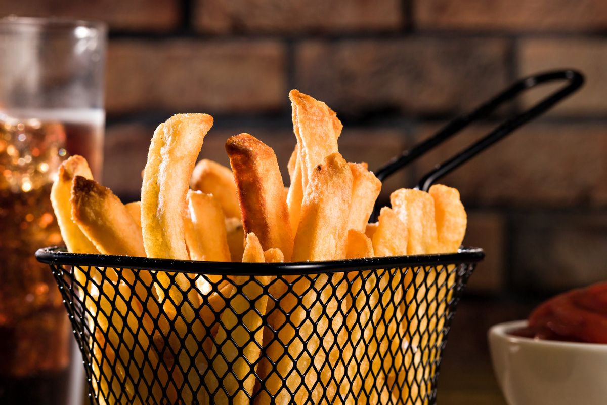 Crispy fries in a metal basket