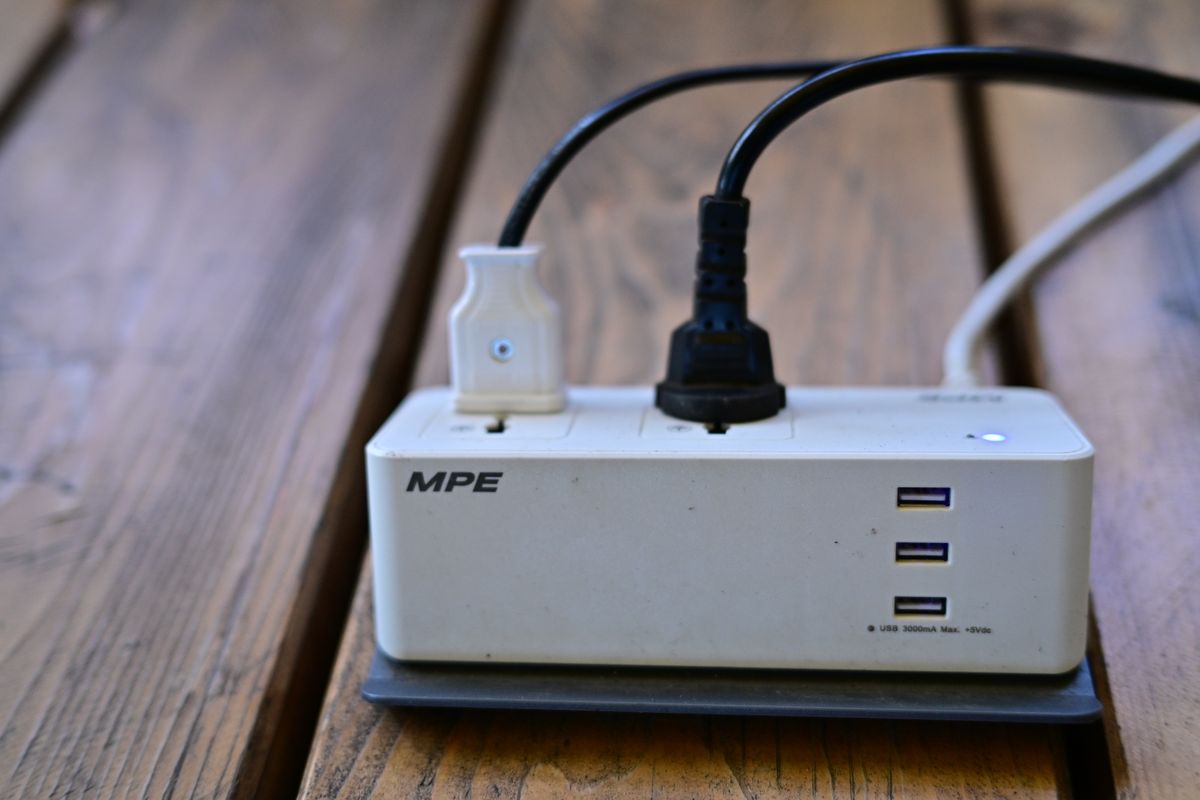Power strip with several plugs connected