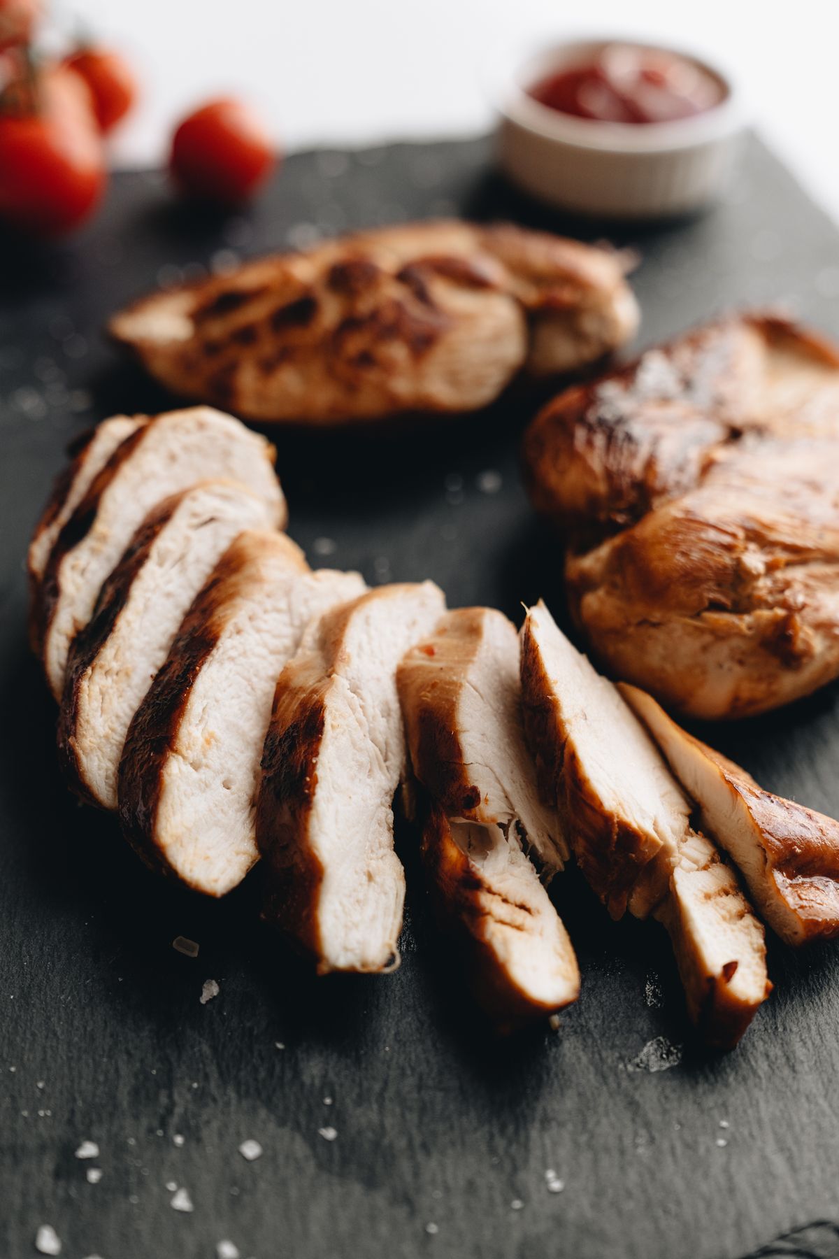 Sliced cooked chicken breast showing a juicy centre